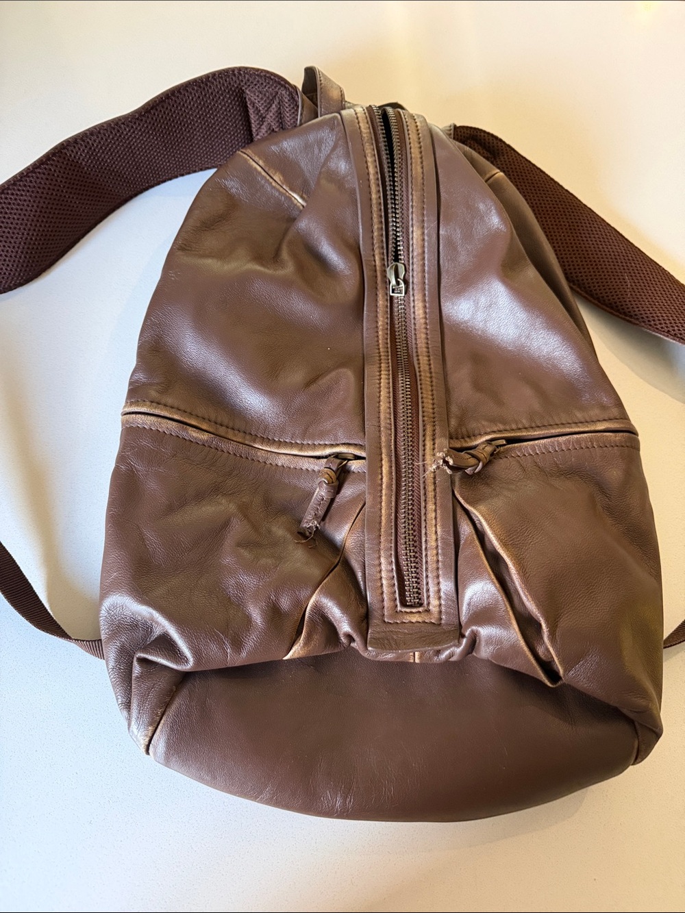 Free People Brown Leather Sling Backpack with Front Vertical Zip